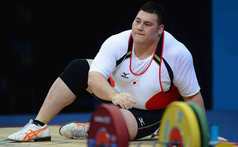 Weightlifter Kazuomi Ota of Japan takes a moment after failing to lift the required weight in the men's +105kg  final in London. At 6 feet and 324 pounds, Ota is one of the largest Olympians.