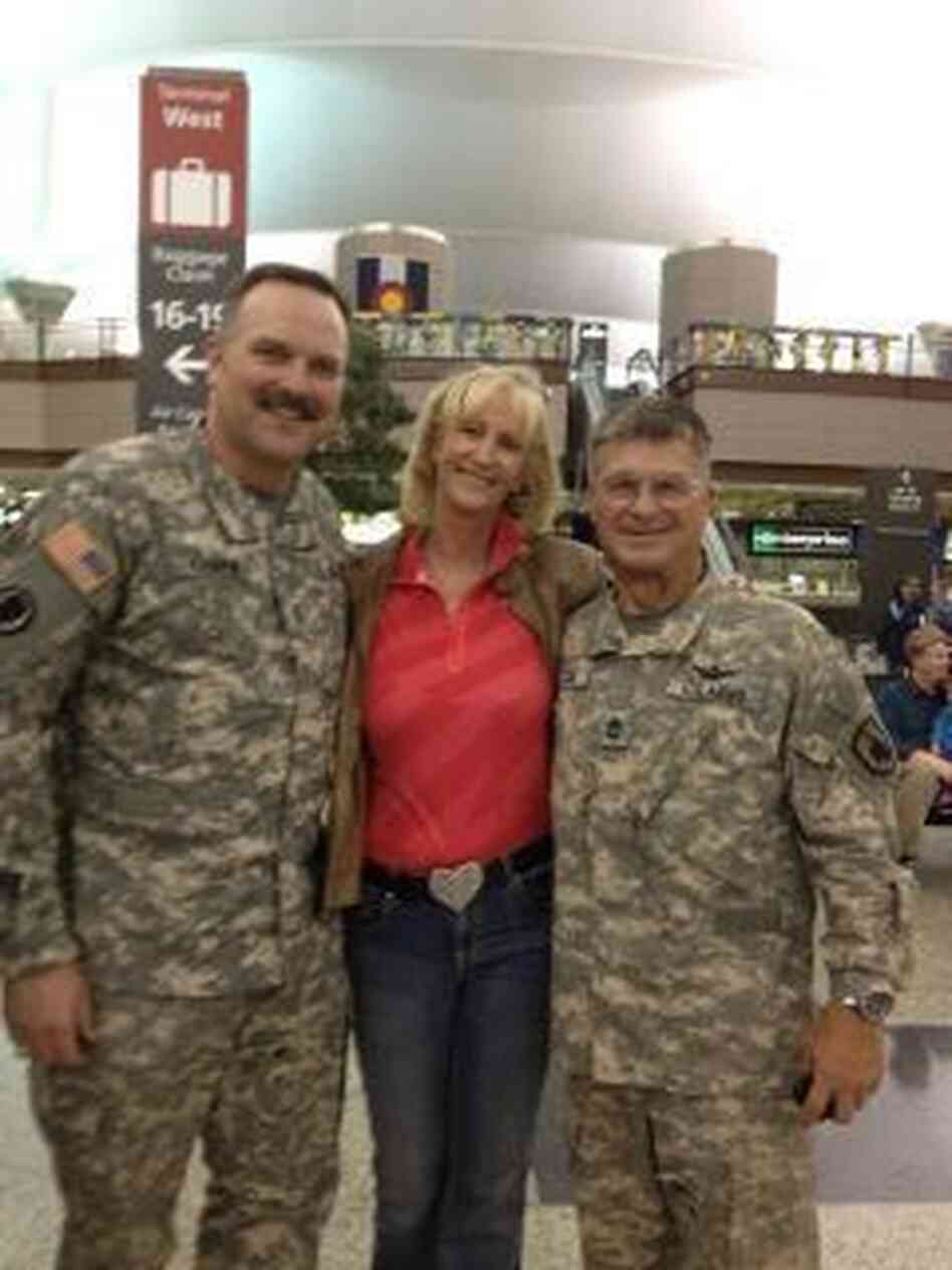 Lainey Hamrick, center, flanked by the folks she supports. Lainey Hamrick, center, flanked by the folks she supports.