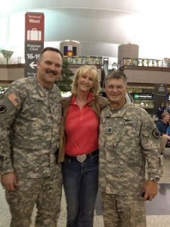 Lainey Hamrick, center, flanked by the folks she supports.