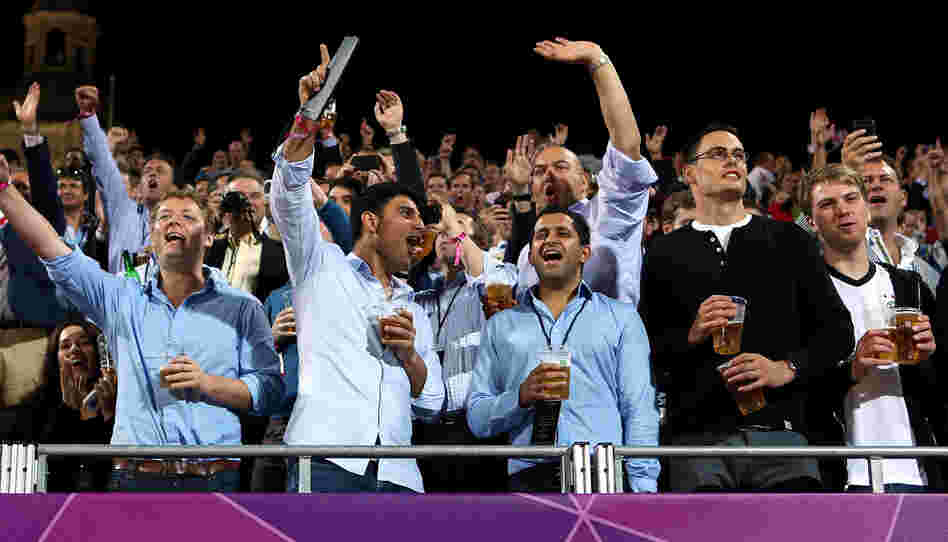 Fans make some noise as they watch Olympic women's beach volleyball at Horse Guards Parade in London. There seems to be little consistency in which sports require quiet from spectators.