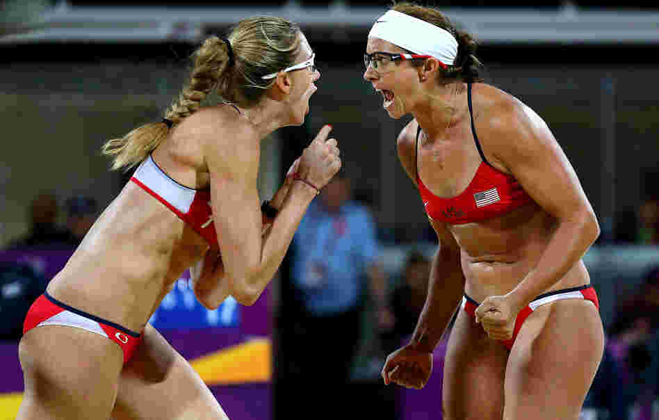 Americans Kerri Walsh Jennings (left) and Misty May-Treanor yell after winning a record third-straight gold medal in women's beach volleyball, at the Horse Guard's Parade in London.