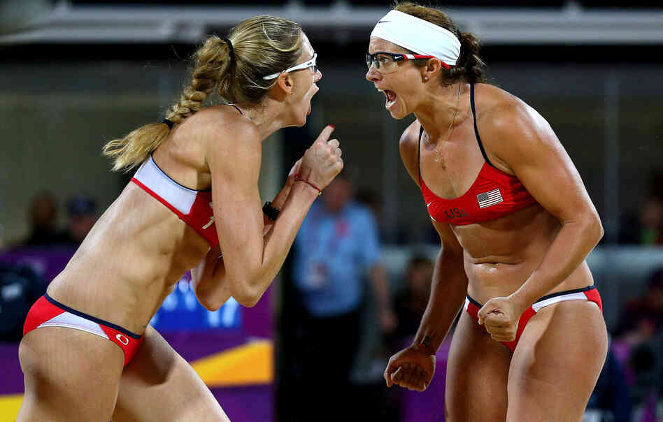 Americans Kerri Walsh Jennings (left) and Misty May-Treanor yell after winning a record third-straight gold medal in women's beach volleyball, at the Horse Guard's Parade in London.