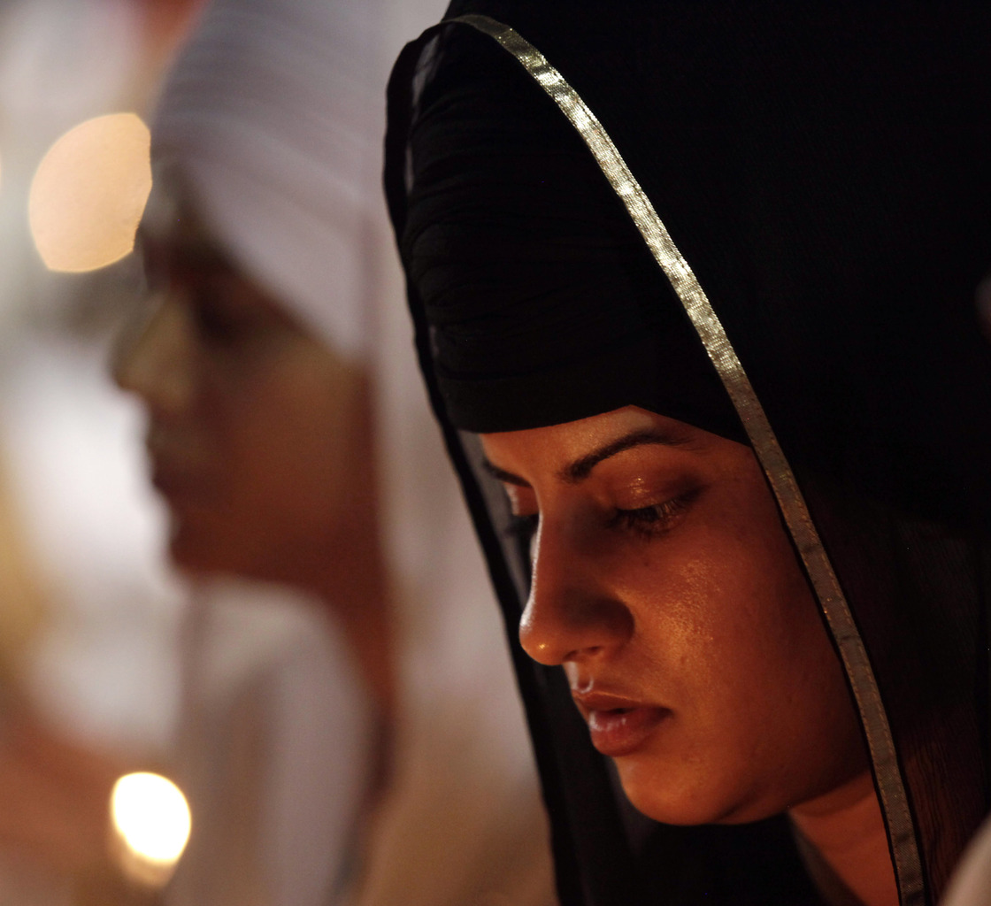 Mourners gathered Tuesday night in Oak Creek, Wis.