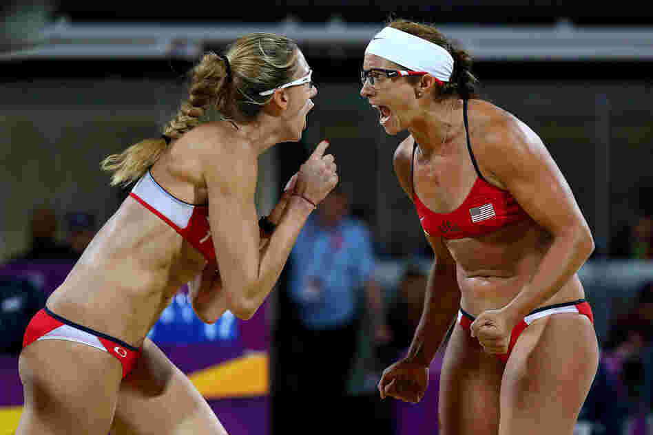 Kerri Walsh Jennings (left) and Misty May-Treanor of the United States celebrate winning the gold medal in the women's beach volleyball finals against April Ross and Jennifer Kessy of the United States.