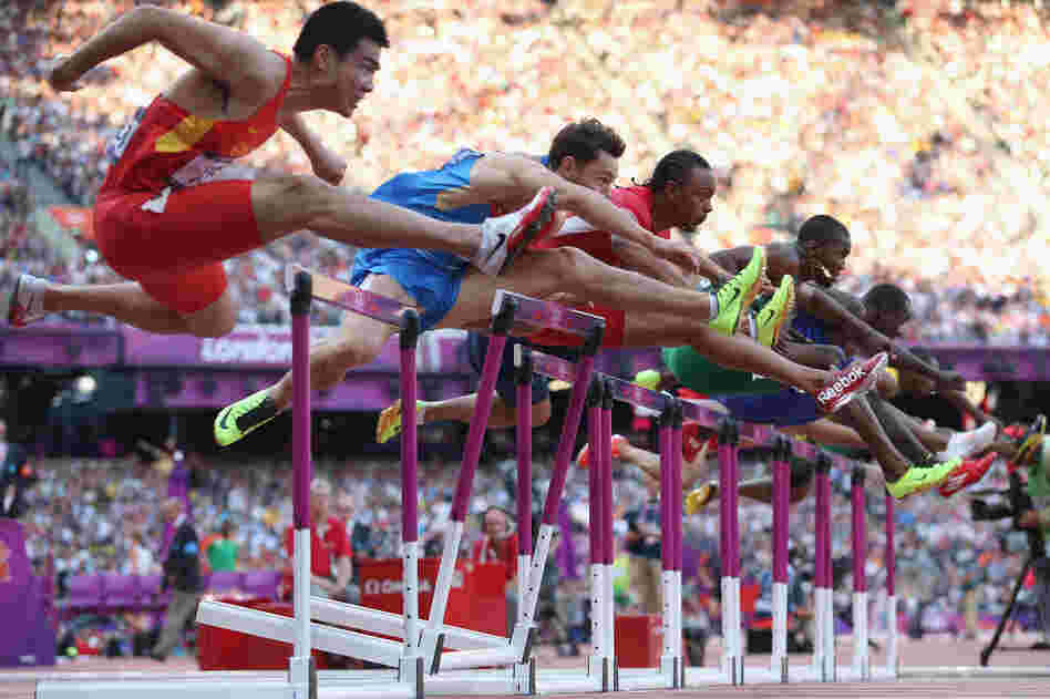 Wenjun Xie of China (left), Konstantin Shabanov of Russia, Aries Merritt of the U.S., Andrew Turner of Great Britain and Selim Nurudeen of Nigeria compete in the men's 110-meter hurdles semifinal.