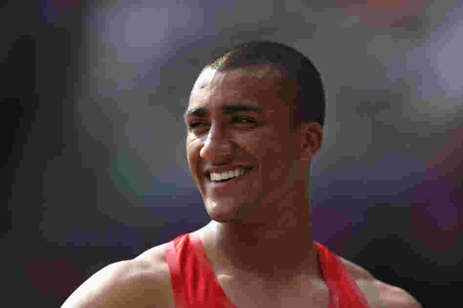 Ashton Eaton of the United States smiles after competing in the Men's Decathlon Pole Vault  in London.