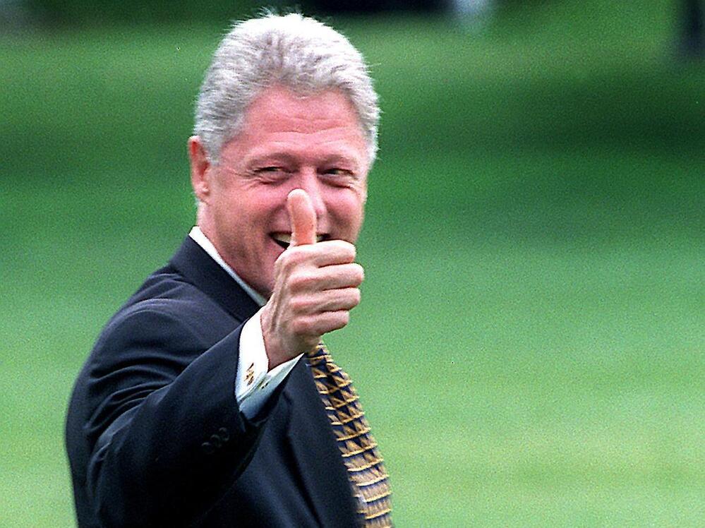 What a difference 14 years makes. Here, Bill Clinton departs the White House on July 31, 1998, after telling reporters he wouldn't take questions about the Monica Lewinsky investigation.