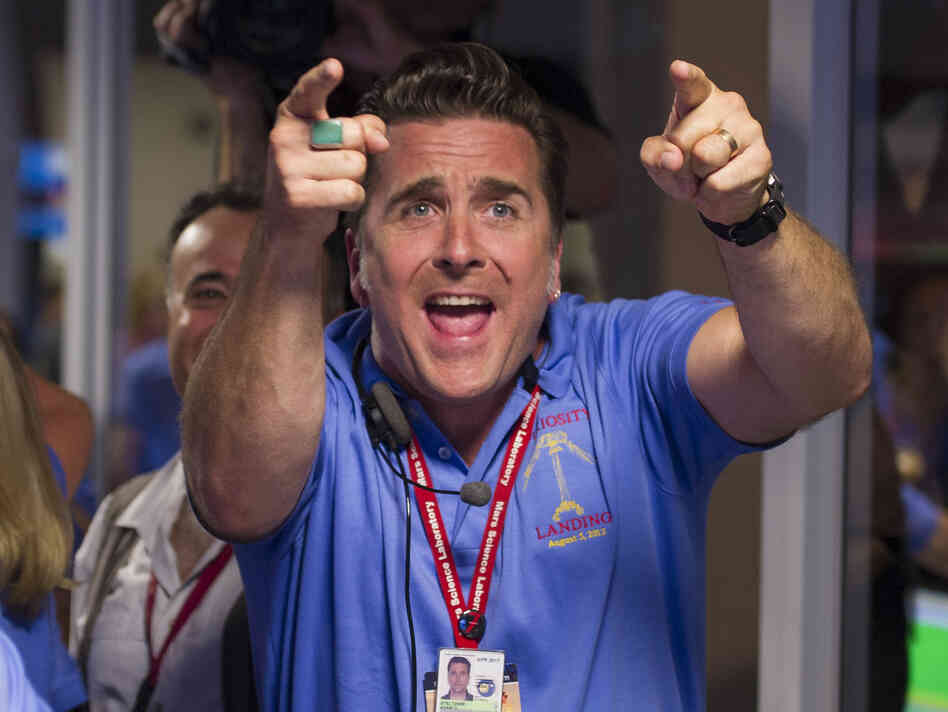 Adam Steltzner, the leader of the rover's entry, descent and landing engineering team, cheers after Curiosity touched down safely on Mars on Sunday.