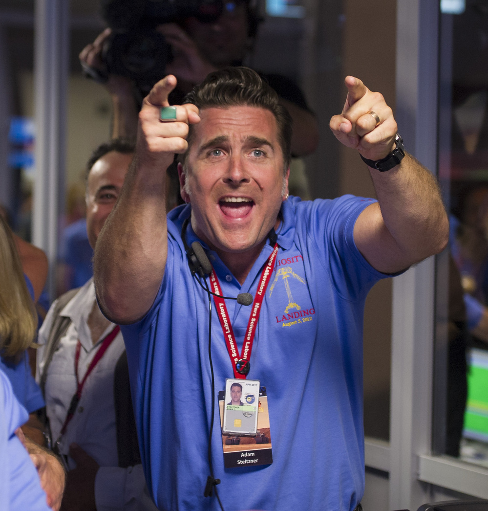 Adam Steltzner, the leader of the rover's entry, descent and landing engineering team, cheers after Curiosity touched down safely on Mars on Sunday.