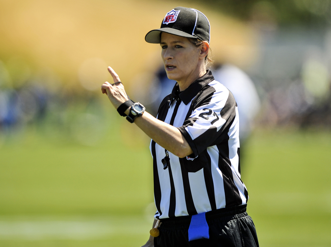 In this photo taken on Saturday, Aug. 4, 2012, and provided by the Seattle Seahawks, NFL official Shannon Eastin works during the Seahawks NFL football training camp in Renton, Wash.