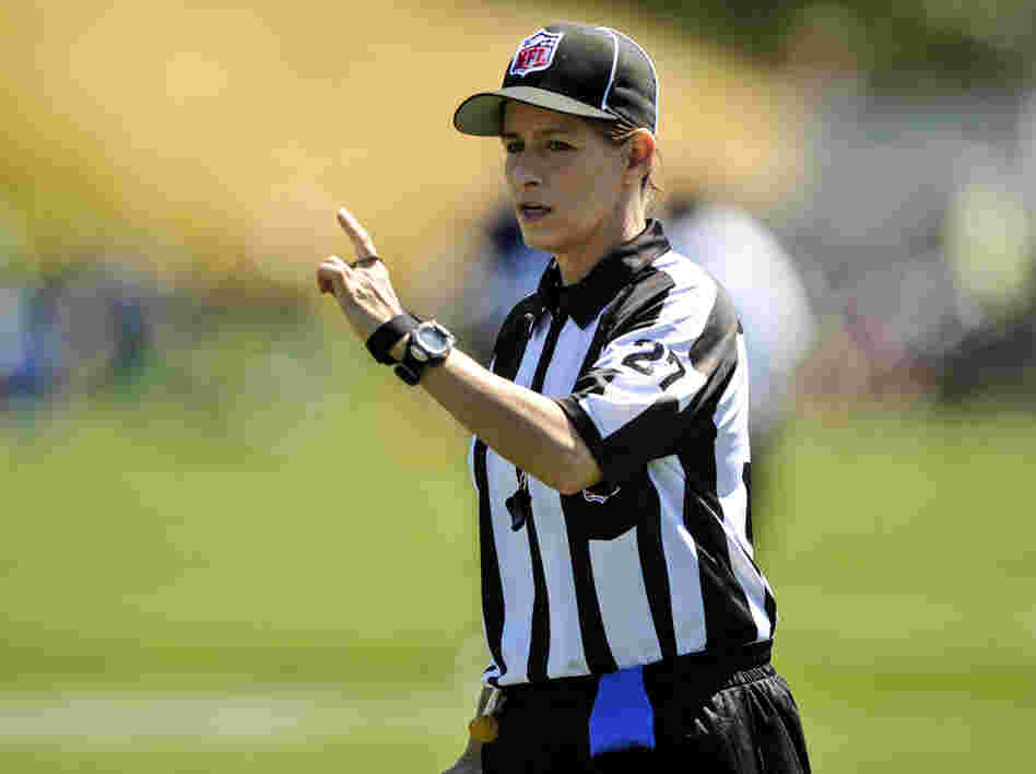 In this photo taken on Saturday, Aug. 4, 2012, and provided by the Seattle Seahawks, NFL official Shannon Eastin works during the Seahawks NFL football training camp in Renton, Wash.