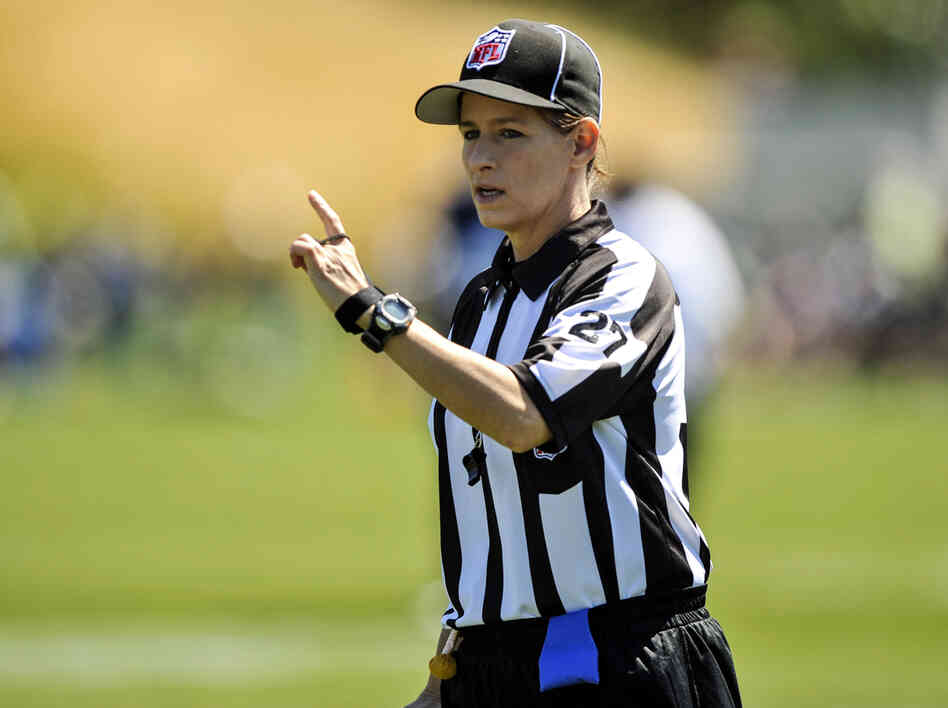 In this photo taken on Saturday, Aug. 4, 2012, and provided by the Seattle Seahawks, NFL official Shannon Eastin works during the Seahawks NFL football training camp in Renton, Wash.