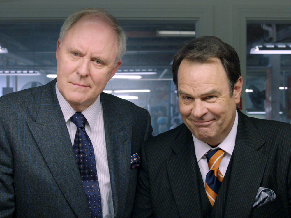 The Motch brothers (John Lithgow and Dan Aykroyd) support Huggins' campaign in hopes of securing their own business interests. The brothers' last name is a not-so-veiled reference to the real-life Koch brothers.