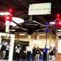 Brian Bills, a flight operations analyst for Lockheed Martin, demonstrates the Procerus VTOL (vertical takeoff and landing) Flight System — a surveillance drone for commercial, civil and military customers — at the Association of Unmanned Vehicle Systems International conference in Las Vegas. (Watch a demo video.)