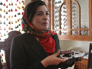 Soraya Paksat of Voice of Afghan Women holds a knife that was confiscated from a woman who came to visit a young relative in one of the group's shelters. The woman intended to kill the girl for fleeing an abusive father. Soraya Paksat of Voice of Afghan Women holds a knife that was confiscated from a woman who came to visit a young relative in one of the group's shelters. The woman intended to kill the girl for fleeing an abusive father.