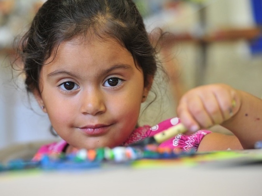 A young girl hangs out at the Maslow Project.