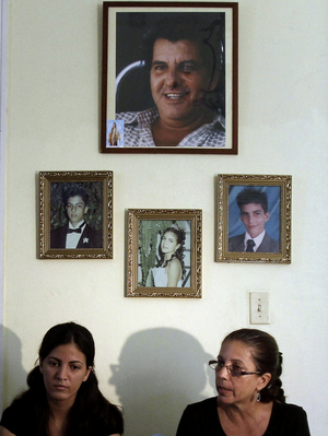 Ofelia Acevedo (right), the widow of Oswaldo Paya, and her daughter Rosa Maria Paya hold a news conference in Havana earlier this month. Acevedo says she doesn't believe her husband's death was an accident. Ofelia Acevedo (right), the widow of Oswaldo Paya, and her daughter Rosa Maria Paya hold a news conference in Havana earlier this month. Acevedo says she doesn't believe her husband's death was an accident.