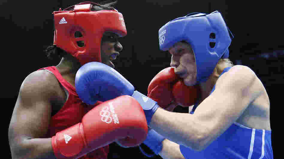 U.S. boxer Claressa Shields (left) lands a punch on Nadezda Torlopova of Russia during the women's boxing middleweight final at the ExCel Arena in London. Shields, 17, won the first-ever gold medal in the event.
