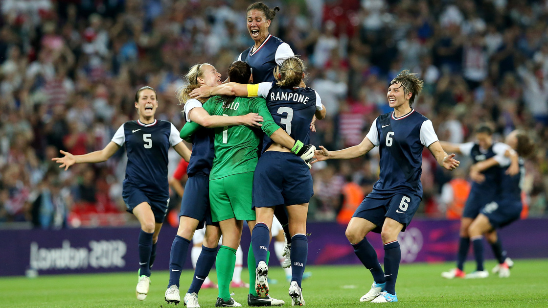 Hope Solo (in green), Shannon Boxx (top), Christie Rampone, Amy LePeilbet (right), and Kelley O'Hara (left) celebrate the U.S. women's soccer team's gold medal, after defeating Japan, 2-1, in London.