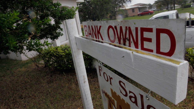 A "bank owned" sign in front of a home in Miami last October.