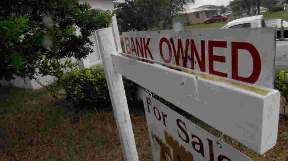 A "bank owned" sign in front of a home in Miami last October.