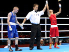 Shiming Zou of China is declared the winner over Paddy Barnes of Ireland during their men's light flyweight boxing semifinal in London. The match was scored a 15-15 tie; Zou won on the number of punches landed. Shiming Zou of China is declared the winner over Paddy Barnes of Ireland during their men's light flyweight boxing semifinal in London. The match was scored a 15-15 tie; Zou won on the number of punches landed.