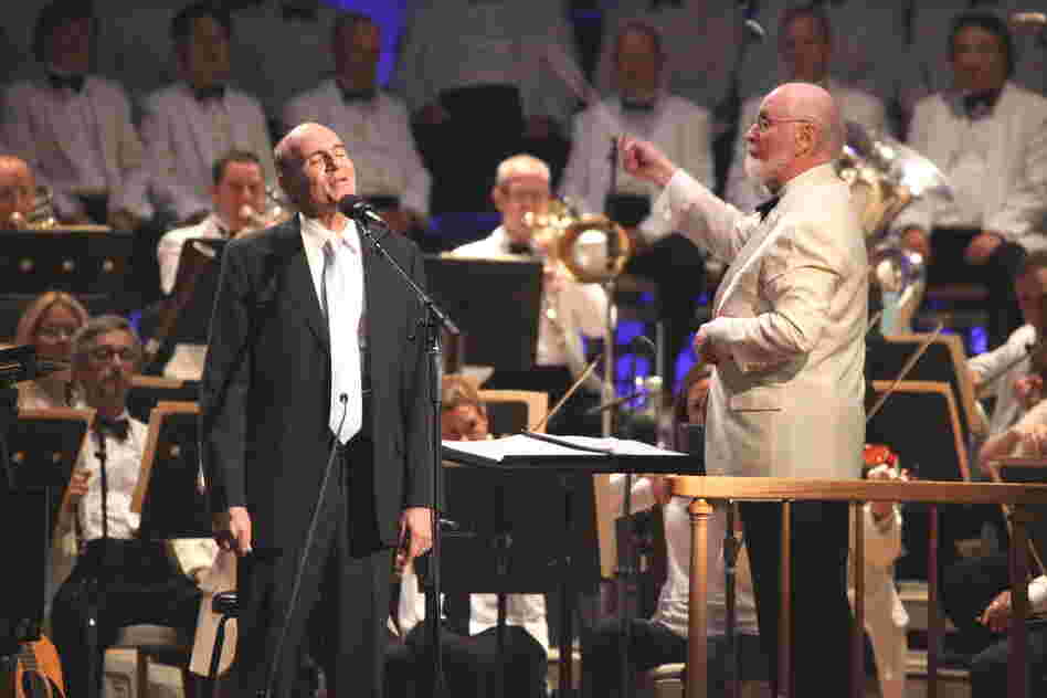 James Taylor, who has made summertime performances at Tanglewood one of his staples in recent years, sang three standards with the Boston Pops and conductor John Williams.