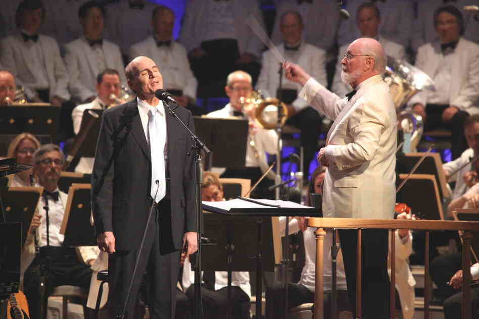 James Taylor, who has made summertime performances at Tanglewood one of his staples in recent years, sang three standards with the Boston Pops and conductor John Williams.