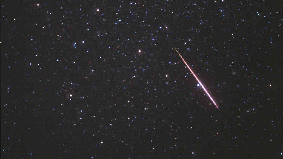 In this photo released by SkyandTelescope.com, a Perseid meteor flashes across the constellation Andromeda on Aug. 12, 1997.