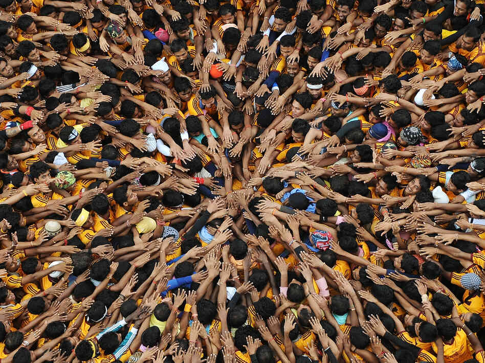 Before building the pyramid, the men and boys prayed.