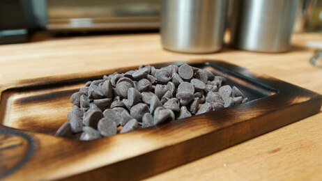 Chocolate chips, fresh out of the smoker at Hot Cakes Molten Chocolate Cakery in Seattle. Chocolate chips, fresh out of the smoker at Hot Cakes Molten Chocolate Cakery in Seattle.