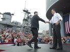 Rep. Paul Ryan of Wisconsin shakes hands with Mitt Romney as he's introduced as Romney's vice presidential running mate Saturday in Norfolk, Va. The USS Wisconsin is in the background. Rep. Paul Ryan of Wisconsin shakes hands with Mitt Romney as he's introduced as Romney's vice presidential running mate Saturday in Norfolk, Va. The USS Wisconsin is in the background.