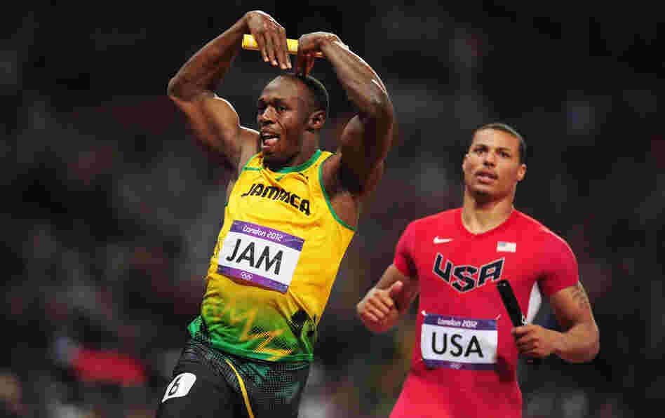 Usain Bolt of Jamaica celebrates his relay team's world record by doing the "mobot" move, made famous by Mo Farah of Britain. Bolt crossed the finish line in front of Ryan Bailey of the United States.