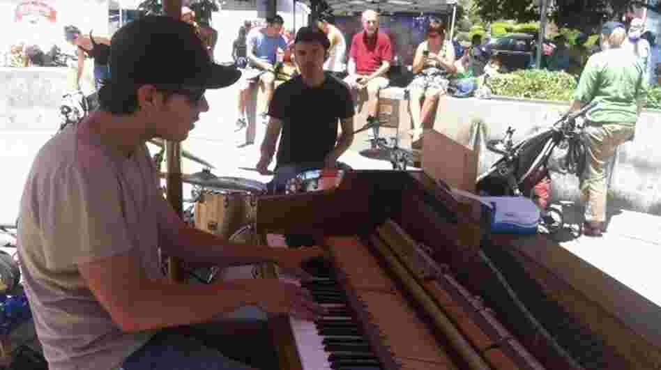 Pianist Kirby Lee Hammel and drummer Jake Alexander perform as Clangin' & Bangin' at an Oakland farmers market.