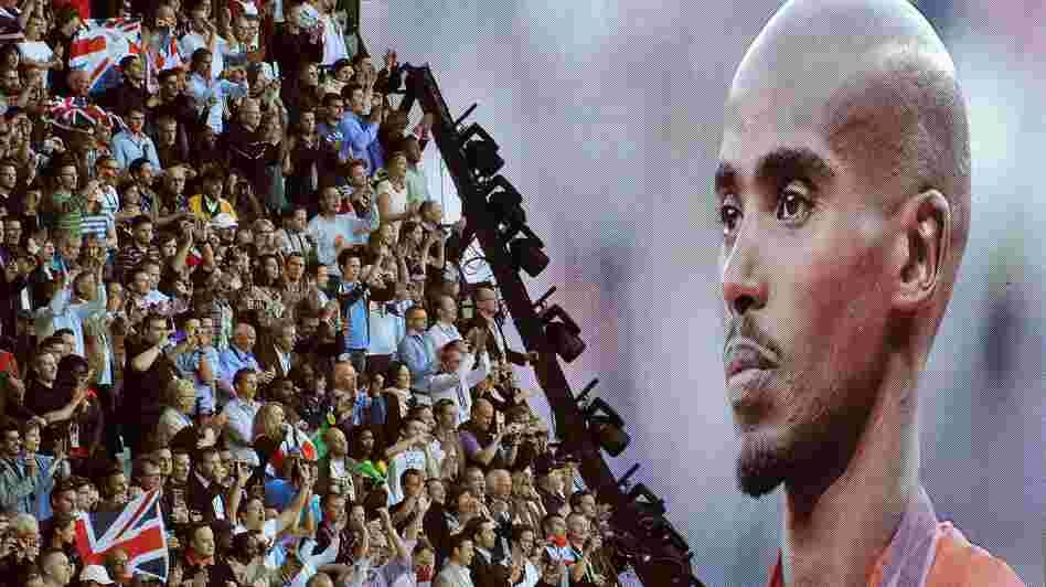 British runner Mo Farah is cheered as he appears on a giant screen at Olympic Stadium, accepting his gold medal for the 10,000 meters. Farah has become a celebrity in Britain since his win.