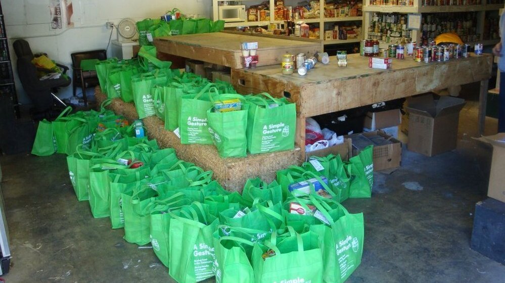 Cool green bags of food for the hungry from A Simple Gesture.