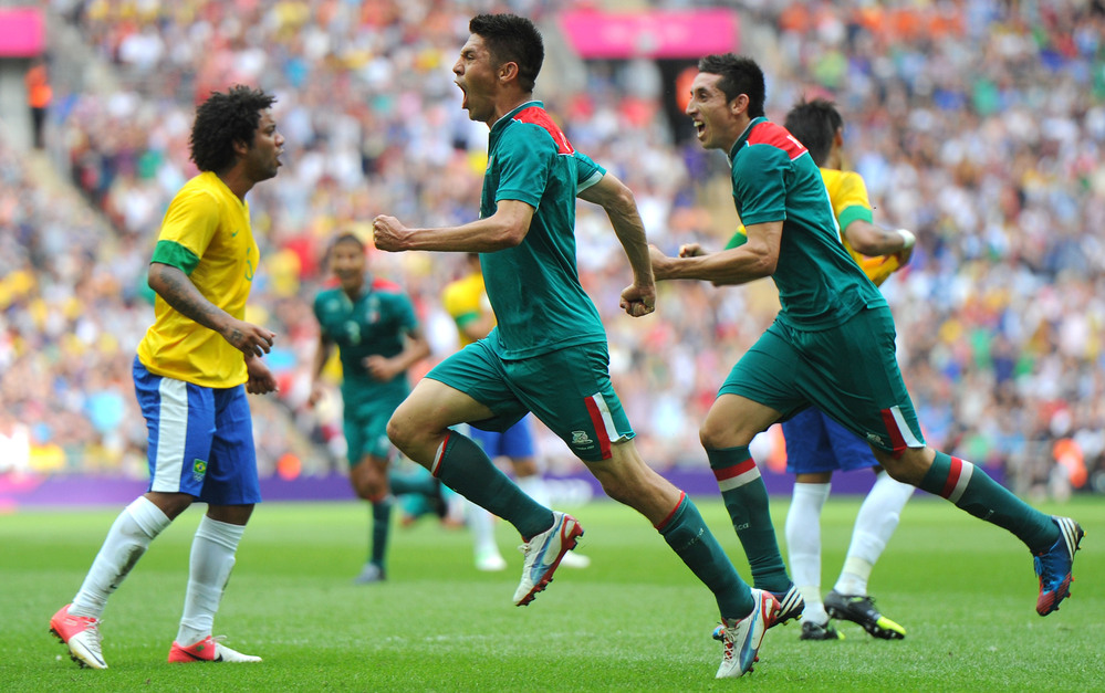 Oribe Peralta of Mexico celebrates scoring his second goal as Mexico beat Brazil, 2-1, to win Olympic gold medal in London's Wembley Stadium.