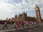 Athletes run along Westminster Bridge next to the Palace of Westminster as they compete in the Men's Marathon in London. Athletes run along Westminster Bridge next to the Palace of Westminster as they compete in the Men's Marathon in London.