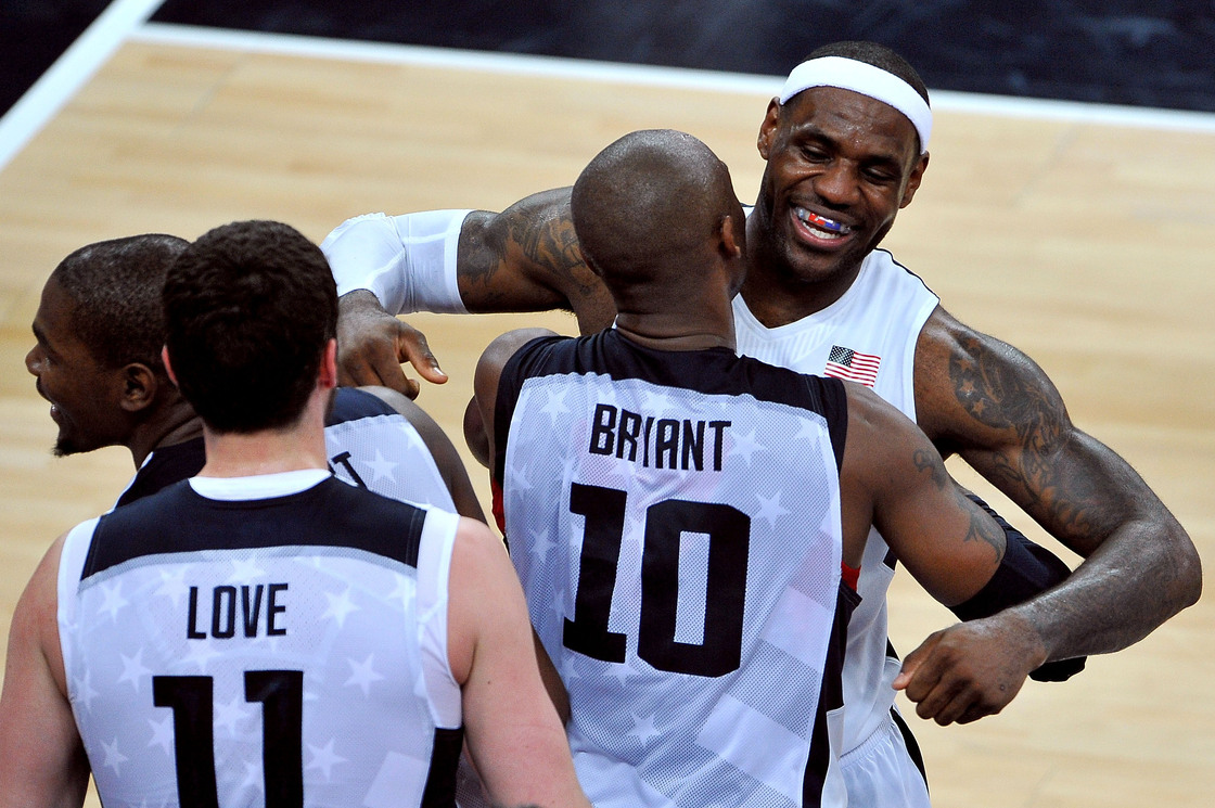 LeBron James of the United States celebrates winning the Men's Basketball gold medal game between the United States and Spain with teammate Kobe Bryant.