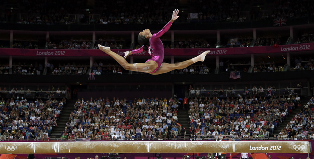 In an iconic moment, Gabrielle Douglas performs on the balance beam during the artistic gymnastics women's individual all-around competition at the 2012 Summer Olympics in London.