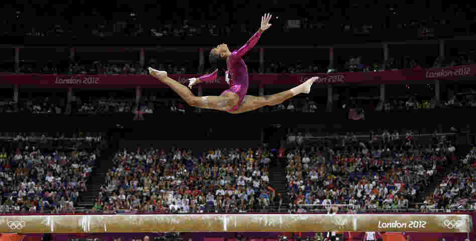 In an iconic moment, Gabrielle Douglas performs on the balance beam during the artistic gymnastics women's individual all-around competition at the 2012 Summer Olympics in London.