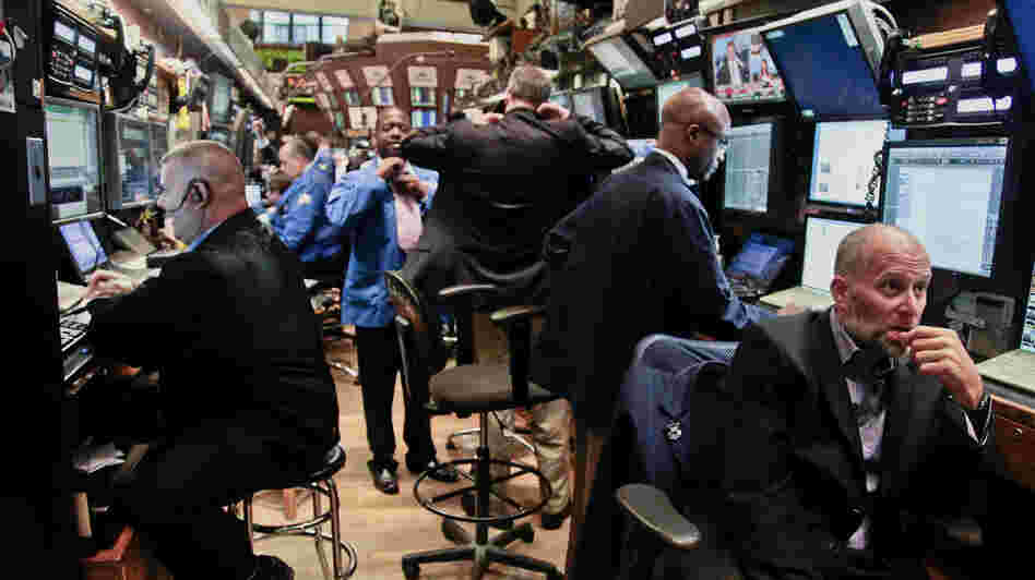 Traders prepare for the start of early trading at the New York Stock Exchange. Some say there's been a loss of faith in the stock market's return on investment over the last 15 years.