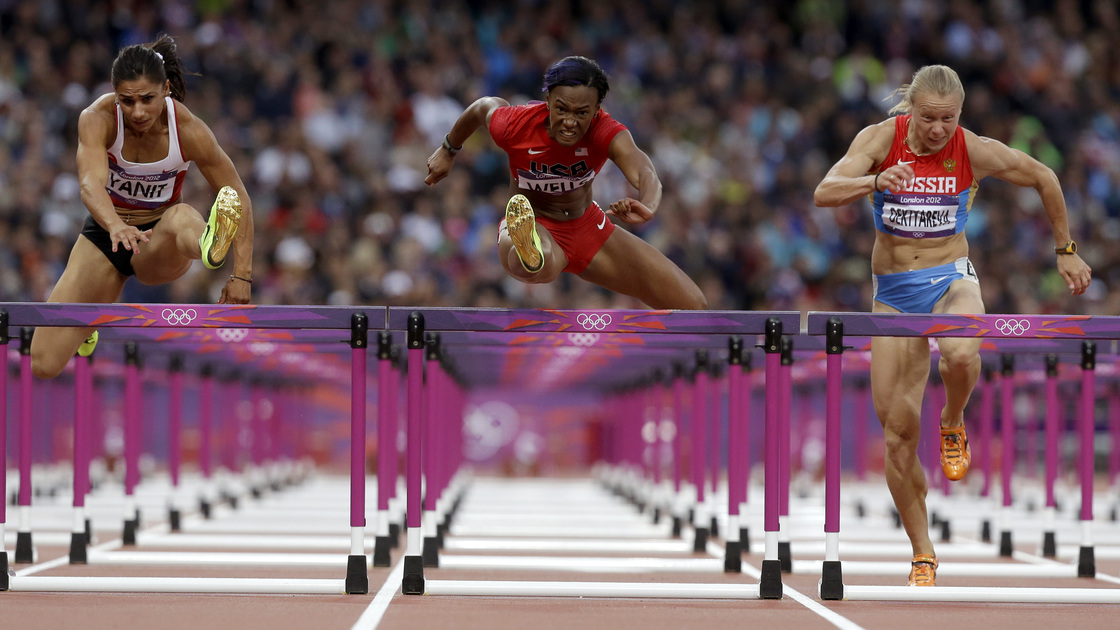 Turkey's Nevin Yanit (from left) United States' Kellie Wells and Russia's Tatyana Dektyareva compete in a women's 100-meter hurdles semifinal. Exactly how many yards is that?