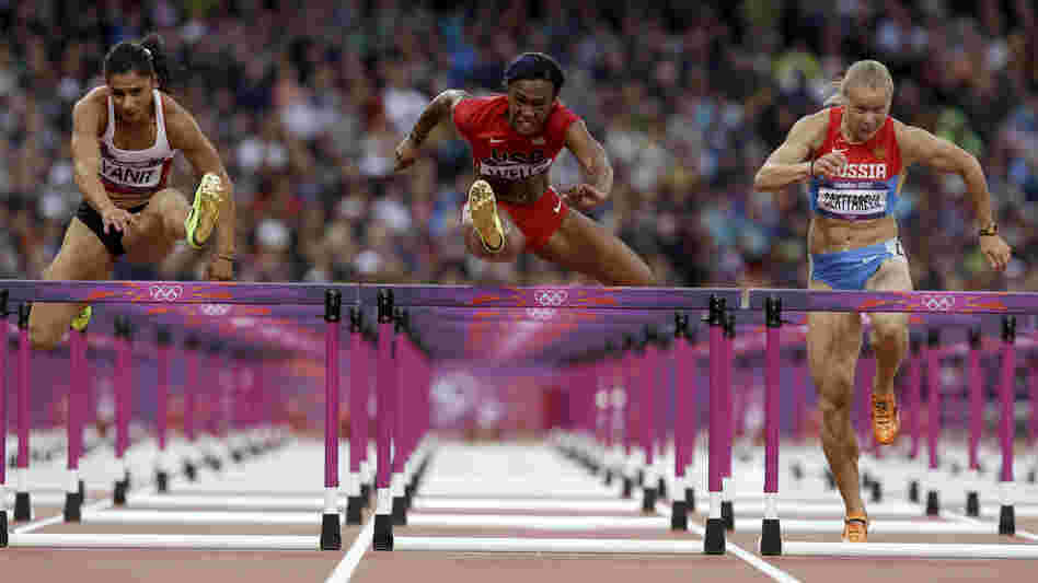 Turkey's Nevin Yanit (from left) United States' Kellie Wells and Russia's Tatyana Dektyareva compete in a women's 100-meter hurdles semifinal. Exactly how many yards is that?