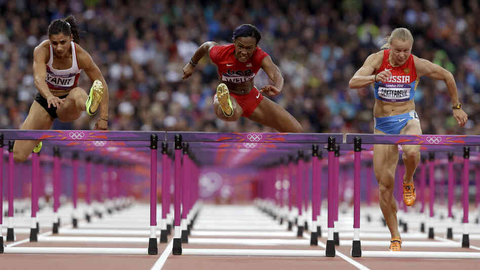 Turkey's Nevin Yanit (from left) United States' Kellie Wells and Russia's Tatyana Dektyareva compete in a women's 100-meter hurdles semifinal. Exactly how many yards is that?