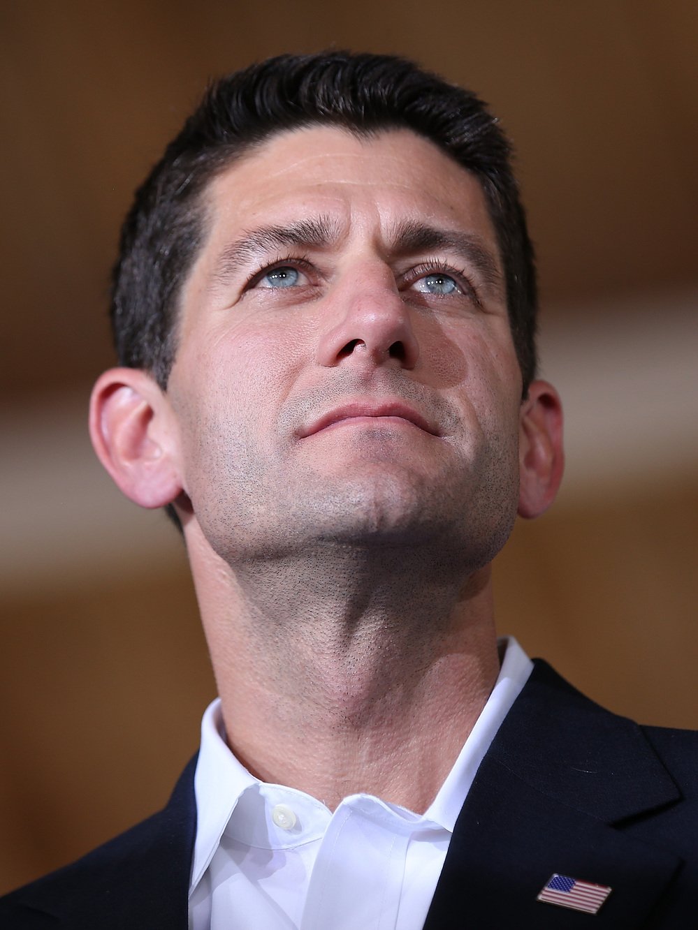 Rep. Paul Ryan, R-Wis., looks on during a campaign rally in Manassas, Va., after being named Mitt Romney's running mate Saturday.