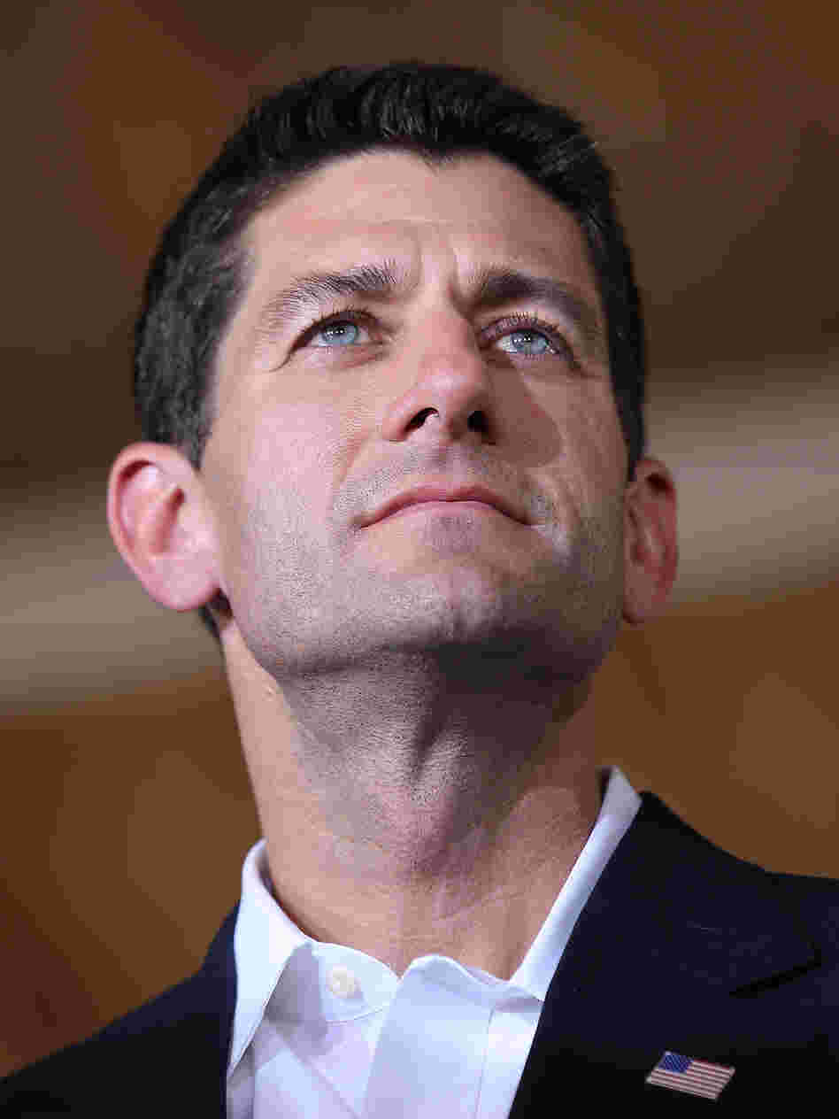 Rep. Paul Ryan, R-Wis., looks on during a campaign rally in Manassas, Va., after being named Mitt Romney's running mate Saturday.
