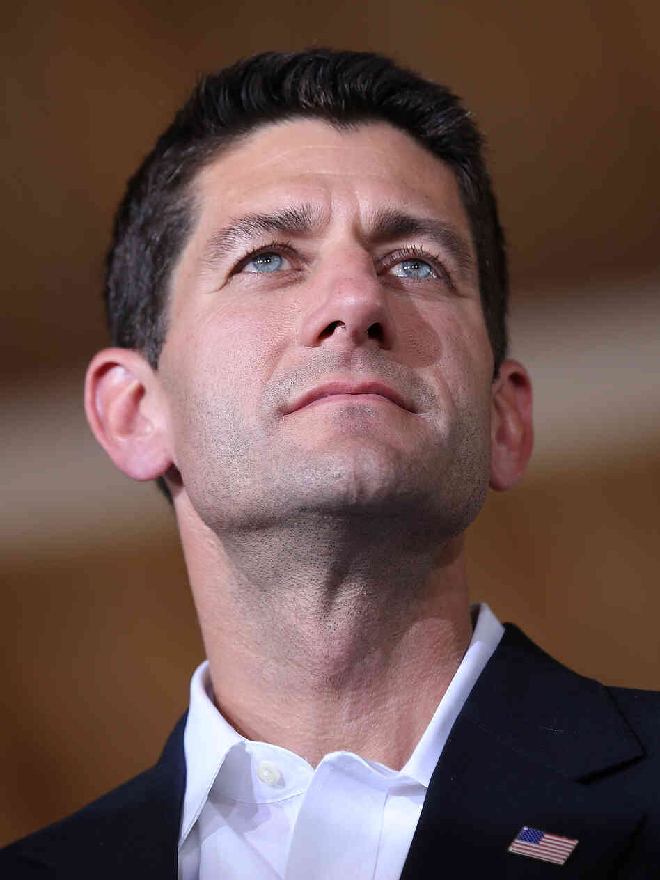 Rep. Paul Ryan, R-Wis., looks on during a campaign rally in Manassas, Va., after being named Mitt Romney's running mate Saturday.