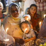 People attend a candlelight vigil for the victims of the Aug. 5 shooting at the Sikh Temple of Wisconsin in Oak Creek, Wis., on Aug. 7. People attend a candlelight vigil for the victims of the Aug. 5 shooting at the Sikh Temple of Wisconsin in Oak Creek, Wis., on Aug. 7.