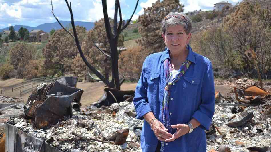 C.J. Moore stands where her front door used to be, before the Waldo Canyon Fire swept through the Mountain Shadows neighborhood in Colorado Springs, Colo. The fire destroyed more than 350 homes there. C.J. Moore stands where her front door used to be, before the Waldo Canyon Fire swept through the Mountain Shadows neighborhood in Colorado Springs, Colo. The fire destroyed more than 350 homes there.